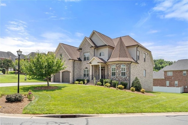 142 Covington Pl, Lewisville, NC 27023 - view of front facade with concrete driveway, a front yard, an attached garage, and stone siding