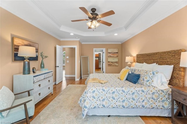 142 Covington Pl, Lewisville, NC 27023 - bedroom with a tray ceiling, wood finished floors, crown molding, recessed lighting, and a ceiling fan