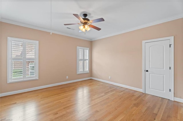 142 Covington Pl, Lewisville, NC 27023 - spare room featuring crown molding, light wood-style flooring, and a ceiling fan