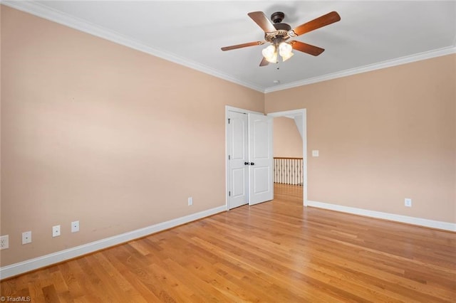142 Covington Pl, Lewisville, NC 27023 - spare room with light wood finished floors, ceiling fan, and crown molding