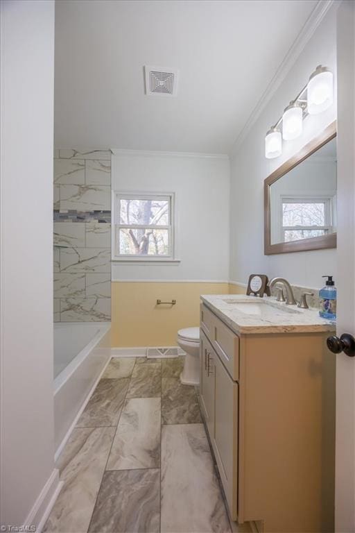 bathroom featuring vanity, toilet, and crown molding