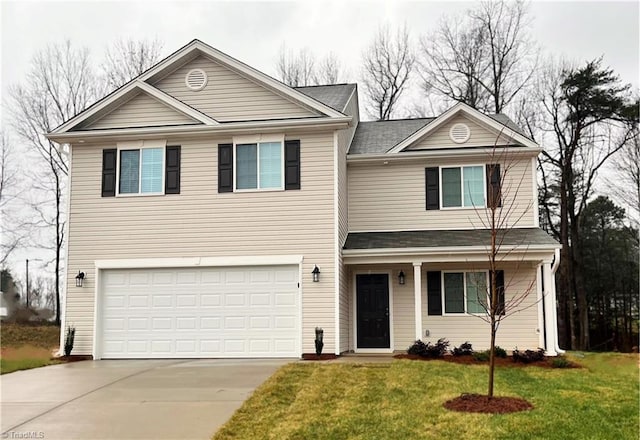 front of property with a garage and a front yard