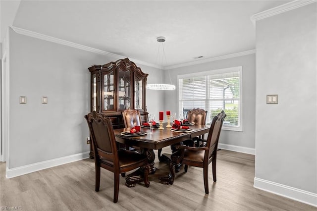 111 Brooke Ridge Dr, Thomasville, NC 27360 - dining area with light wood finished floors, baseboards, and ornamental molding