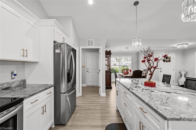 111 Brooke Ridge Dr, Thomasville, NC 27360 - kitchen with stainless steel fridge, light wood-style floors, white cabinets, a chandelier, and a kitchen island