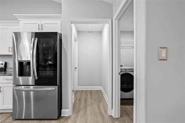 111 Brooke Ridge Dr, Thomasville, NC 27360 - kitchen with stainless steel fridge with ice dispenser, washer / dryer, light wood finished floors, and white cabinetry