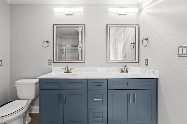 111 Brooke Ridge Dr, Thomasville, NC 27360 - full bathroom with crown molding, double vanity, toilet, an enclosed shower, and baseboards