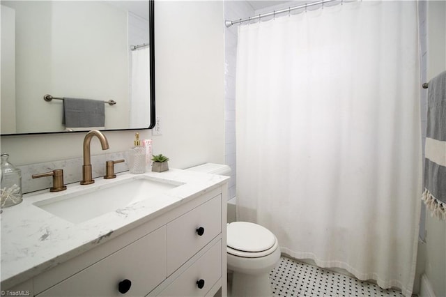 bathroom featuring vanity, toilet, and shower / bathtub combination with curtain