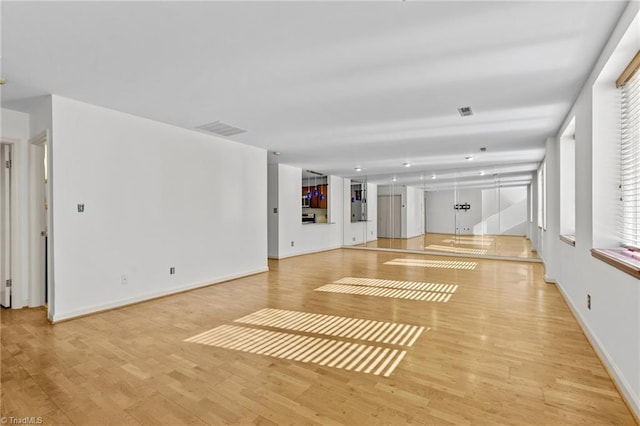 unfurnished living room featuring light hardwood / wood-style flooring