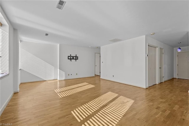 unfurnished room featuring light hardwood / wood-style flooring