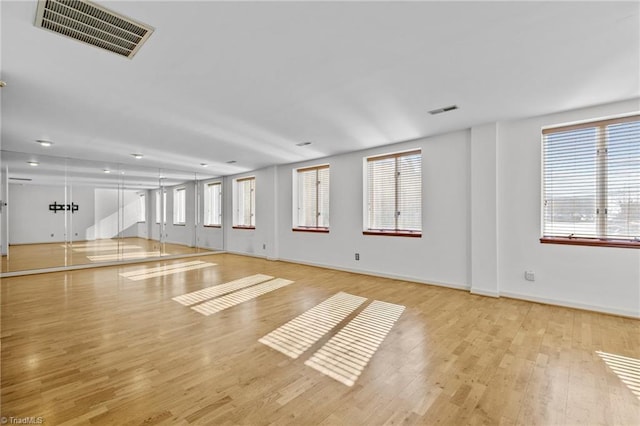 spare room with light hardwood / wood-style flooring