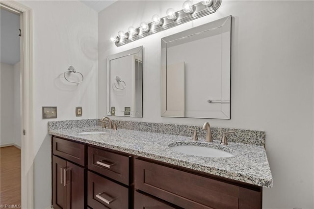 bathroom with vanity and hardwood / wood-style floors