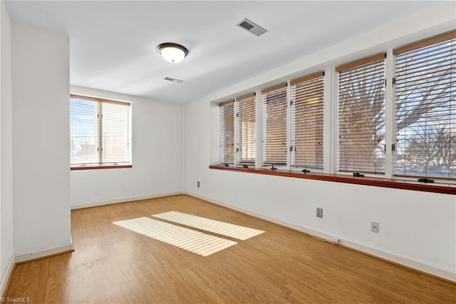 unfurnished room featuring wood-type flooring