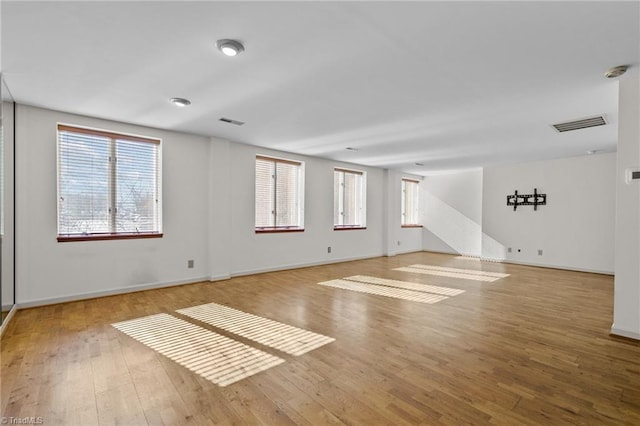 unfurnished room featuring light hardwood / wood-style flooring