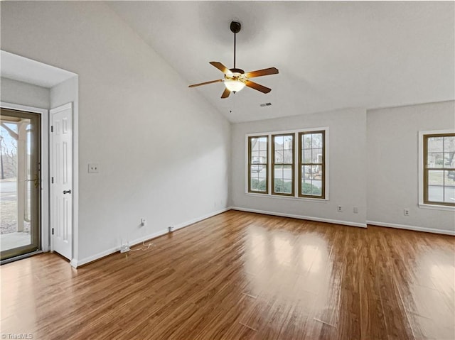 interior space featuring wood-type flooring, ceiling fan, and a healthy amount of sunlight