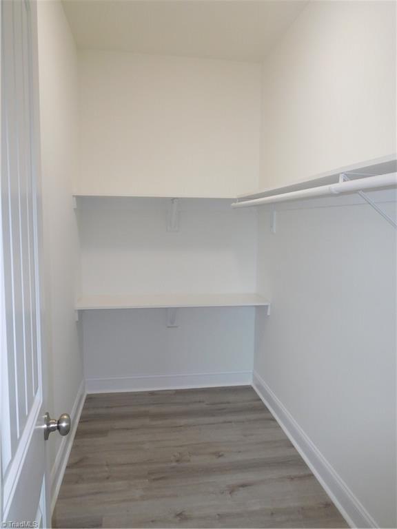 4391 Old Town Dr, Winston-Salem, NC 27106 - walk in closet with wood finished floors
