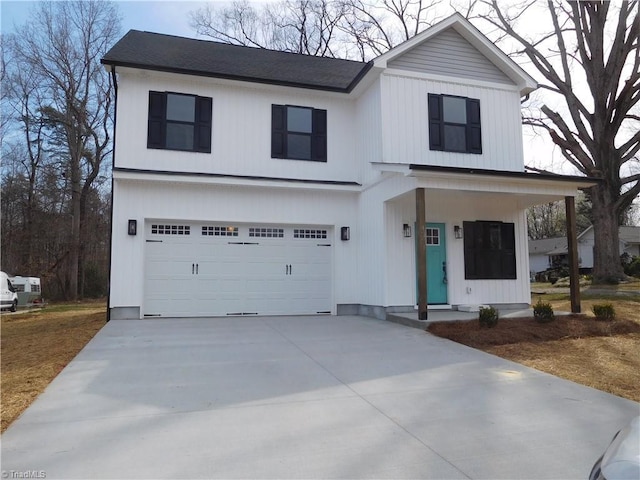 modern inspired farmhouse with concrete driveway and an attached garage