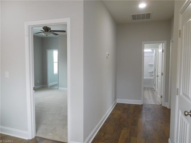 4391 Old Town Dr, Winston-Salem, NC 27106 - hallway featuring wood finished floors, baseboards, and visible vents