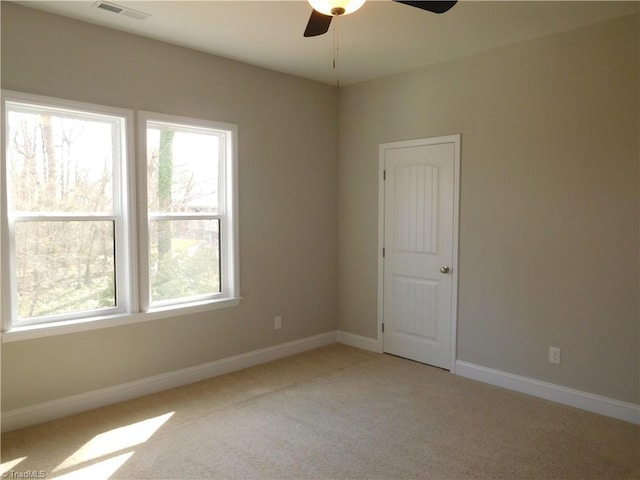 4391 Old Town Dr, Winston-Salem, NC 27106 - empty room with light carpet, visible vents, ceiling fan, and baseboards