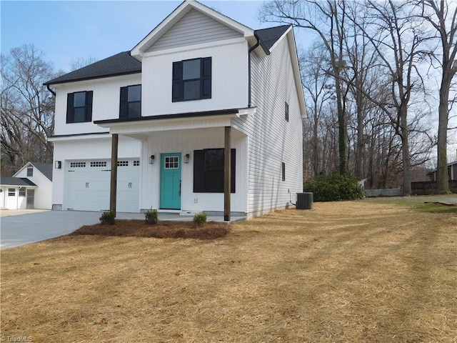 4391 Old Town Dr, Winston-Salem, NC 27106 - view of front facade featuring cooling unit, a front lawn, concrete driveway, and a garage