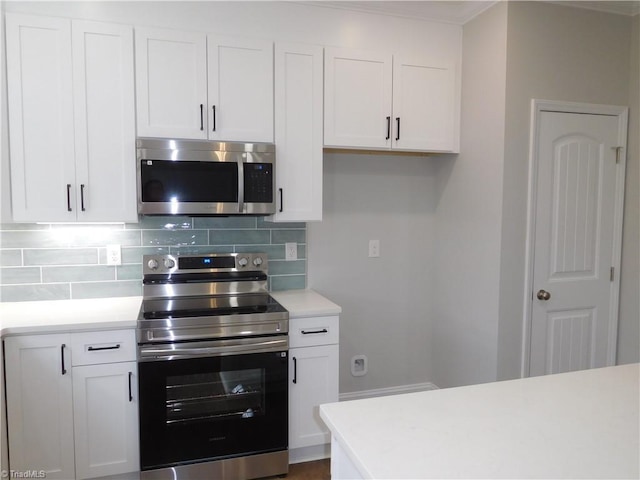 4391 Old Town Dr, Winston-Salem, NC 27106 - kitchen featuring tasteful backsplash, white cabinets, stainless steel appliances, and light countertops