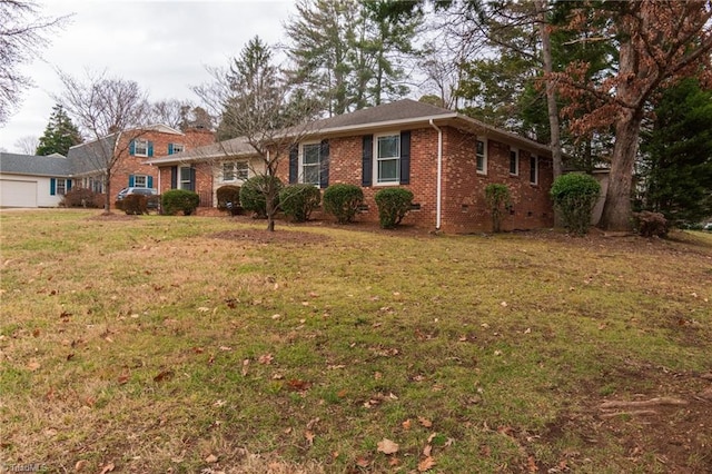 single story home featuring a front lawn