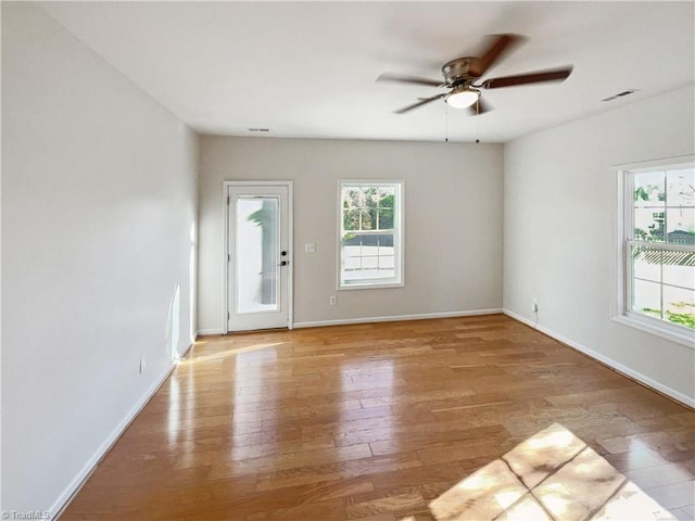 unfurnished room featuring light hardwood / wood-style floors and ceiling fan