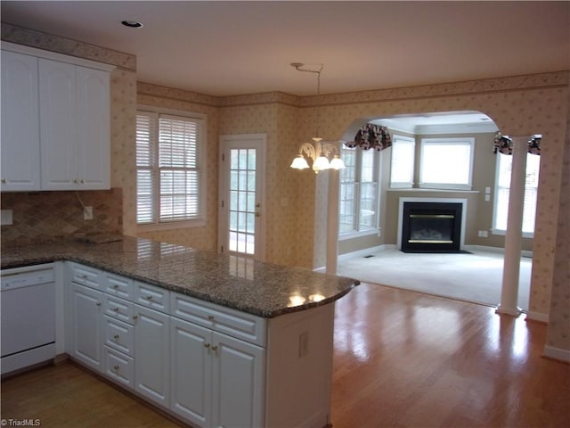 kitchen featuring kitchen peninsula, white cabinetry, white dishwasher, and light wood-type flooring