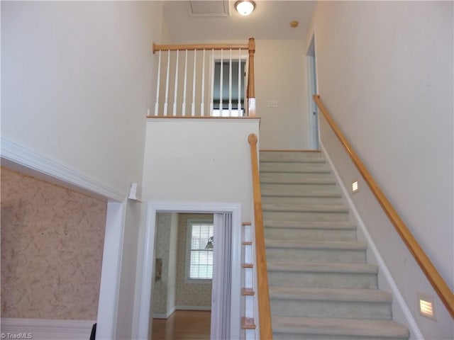 stairway featuring hardwood / wood-style flooring