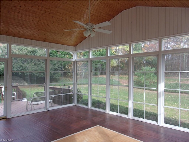 unfurnished sunroom with ceiling fan, wood ceiling, and vaulted ceiling