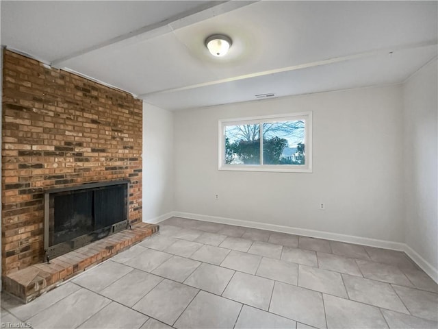 unfurnished living room featuring light tile patterned floors, a fireplace, and baseboards