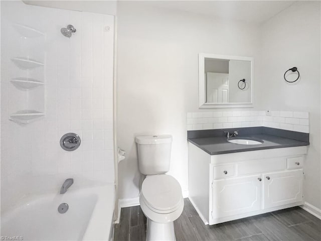 full bath with shower / washtub combination, toilet, decorative backsplash, wood tiled floor, and vanity