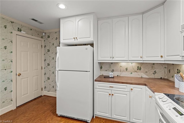 440 Marshall View Ct, Winston-Salem, NC 27101 - kitchen featuring white appliances, wallpapered walls, light wood-style floors, white cabinets, and crown molding