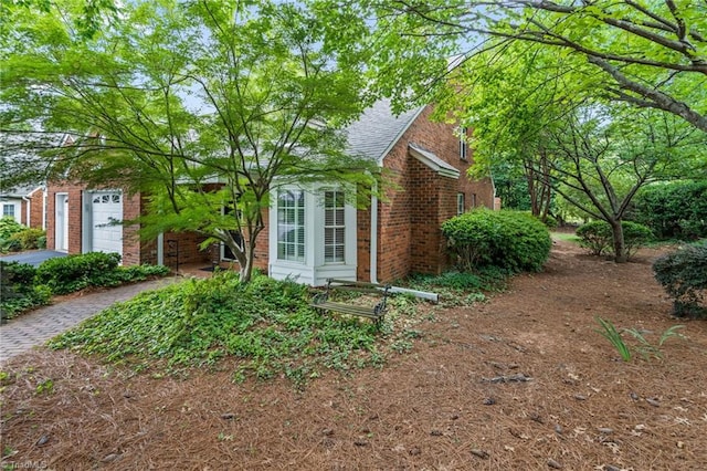 440 Marshall View Ct, Winston-Salem, NC 27101 - view of home's exterior with brick siding and an attached garage