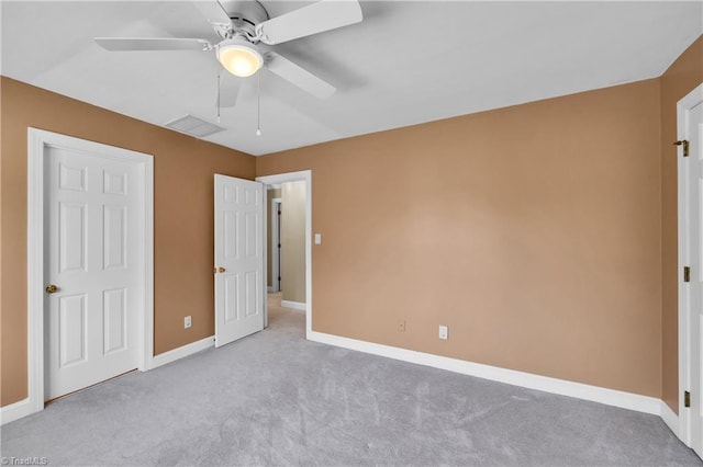 unfurnished bedroom with carpet, baseboards, and a ceiling fan