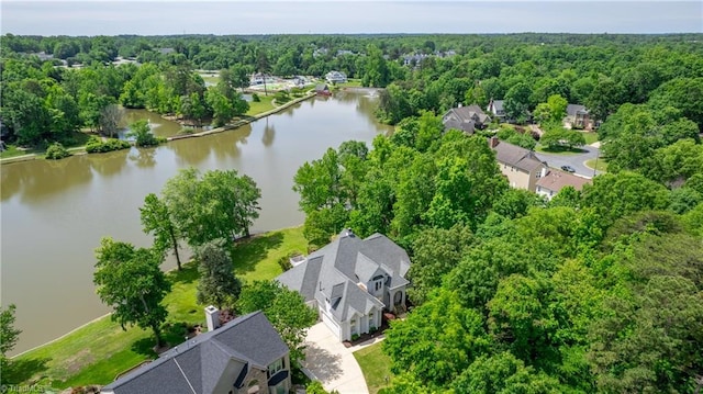 bird's eye view of a nearby body of water and a forest