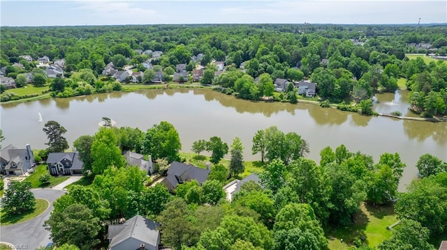 aerial perspective of suburban area featuring a nearby body of water
