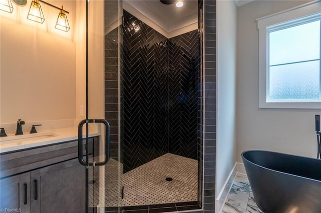 bathroom with independent shower and bath, vanity, and plenty of natural light