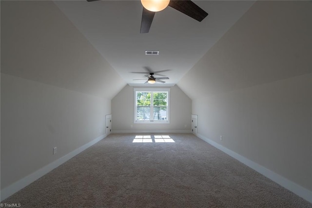 additional living space featuring carpet, vaulted ceiling, and ceiling fan