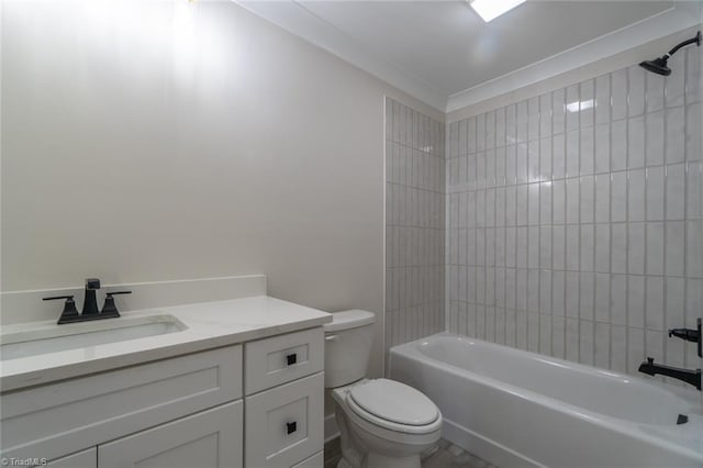 full bathroom featuring tiled shower / bath combo, vanity, and toilet