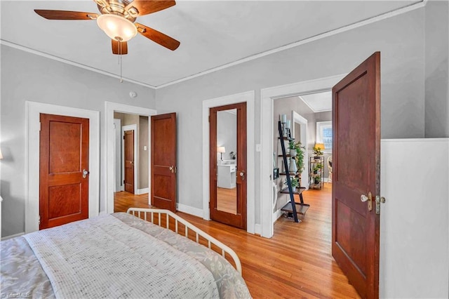 bedroom with light wood-style floors, baseboards, crown molding, and ceiling fan