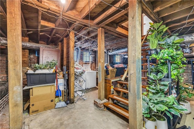 unfinished basement featuring washer / clothes dryer