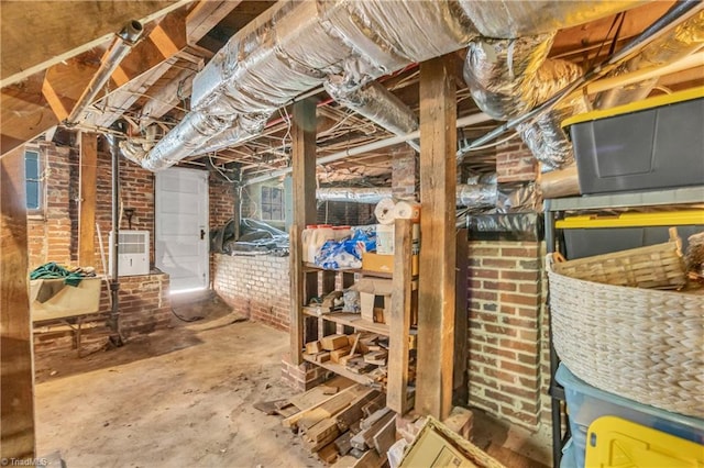 unfinished below grade area with brick wall