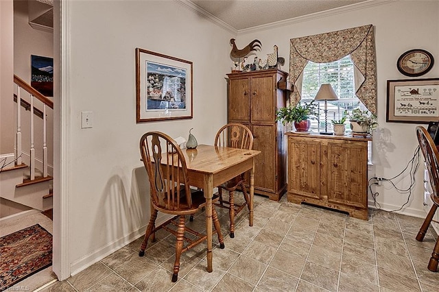 dining space with crown molding