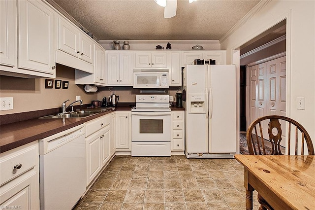 kitchen with white appliances, a textured ceiling, white cabinetry, and sink