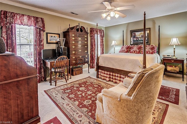 carpeted bedroom with ceiling fan, a textured ceiling, and ornamental molding