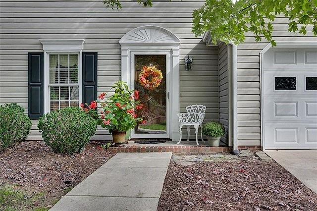 view of exterior entry with a garage