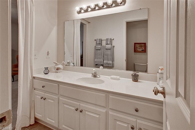 bathroom with vanity and toilet