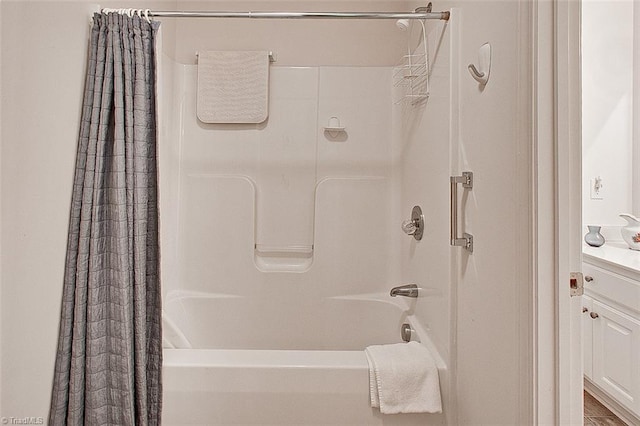 bathroom featuring shower / tub combo with curtain and vanity