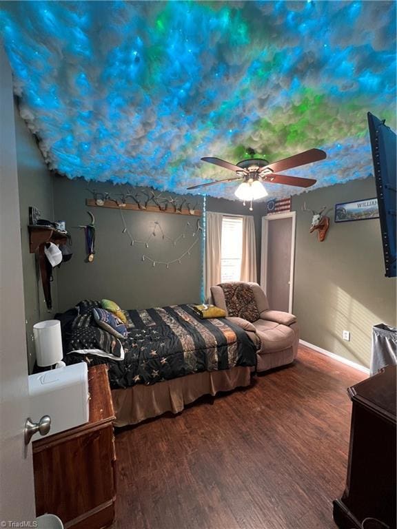 bedroom featuring hardwood / wood-style floors and ceiling fan