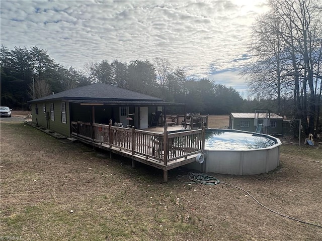 view of swimming pool with a wooden deck